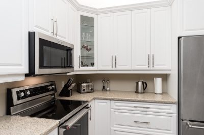white and glass cabinets in kitchen