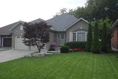 custom grey home with 2 car garage